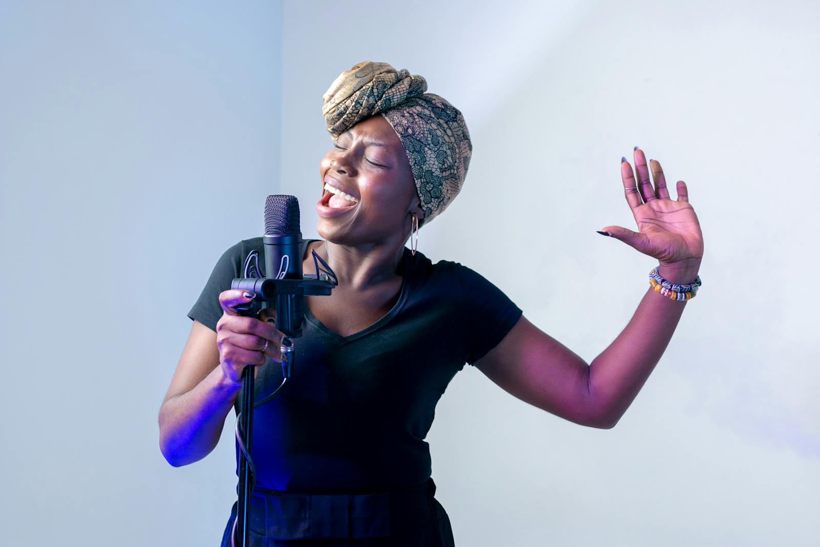 Photo of Woman Singing in Music Studio